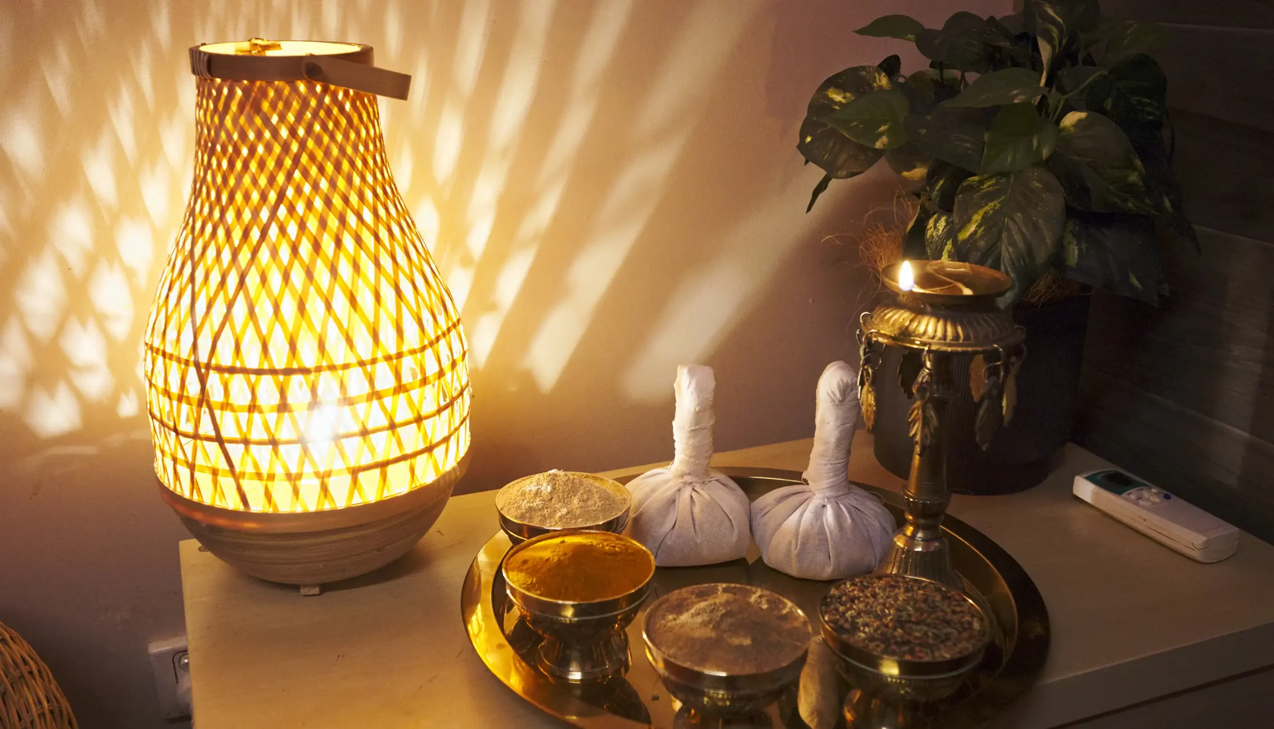 Traditional Ayurvedic herbal therapy setup with natural remedies