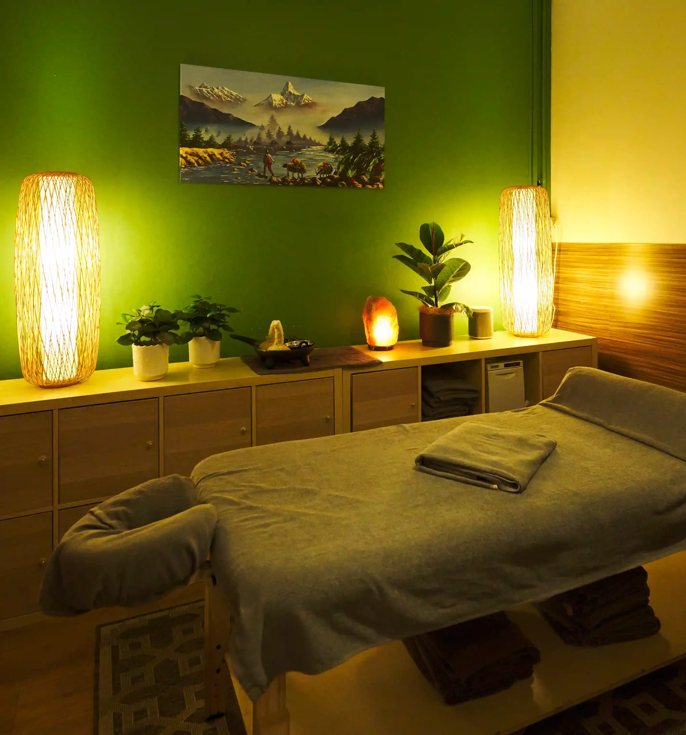 Therapeutic massage treatment room at Vibrant Ayurveda with a calming wellness atmosphere