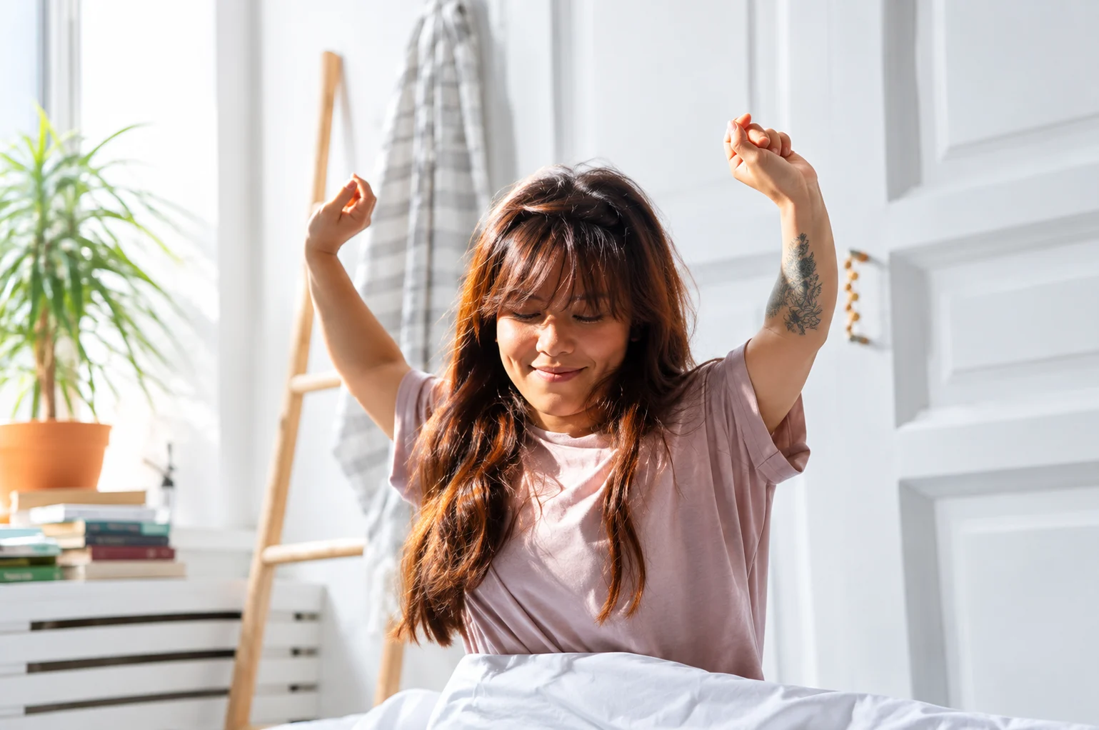 Woman starting the day with a mindful morning stretch