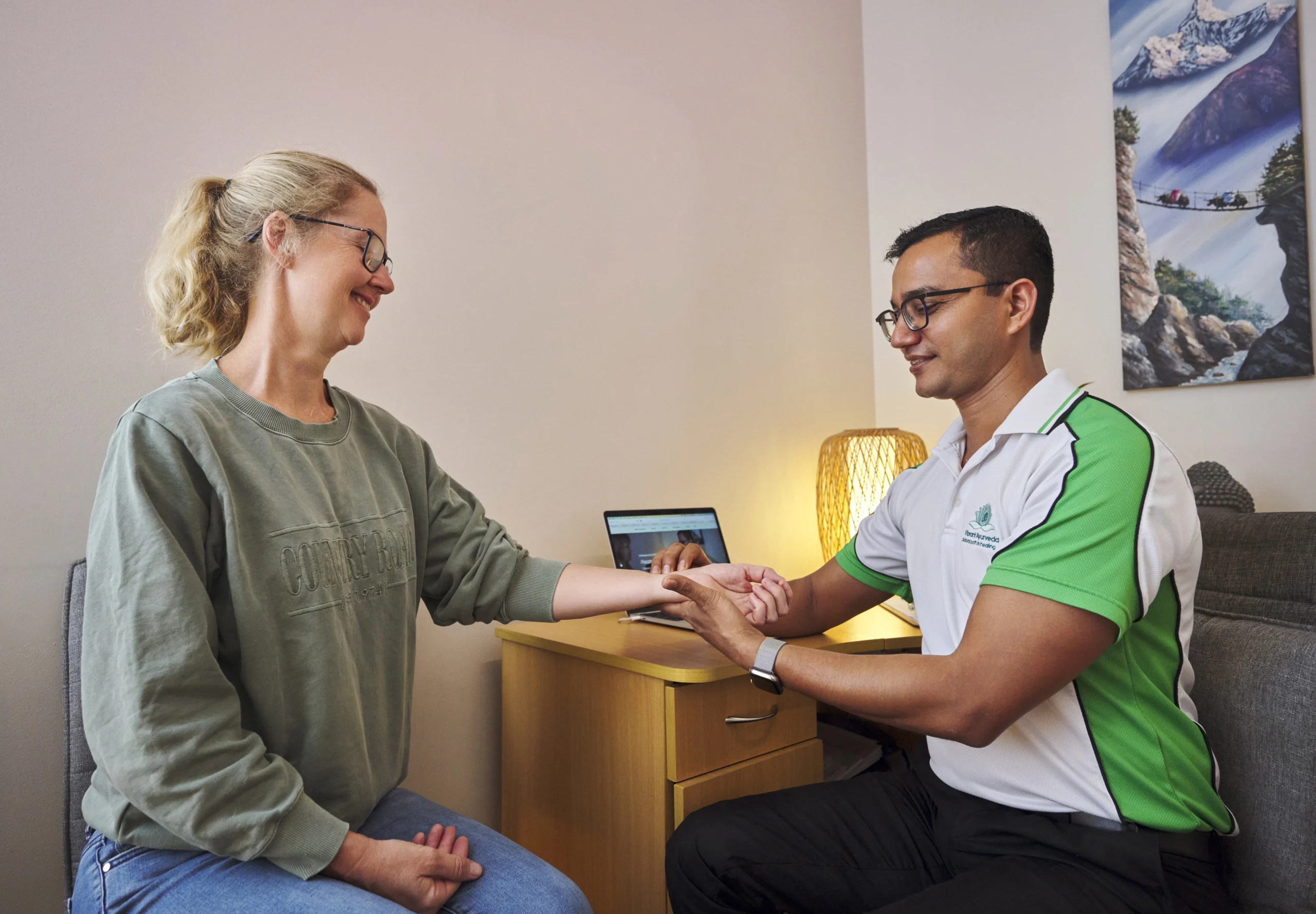 Woman consulting with Ayurvedic practitioner in clinic