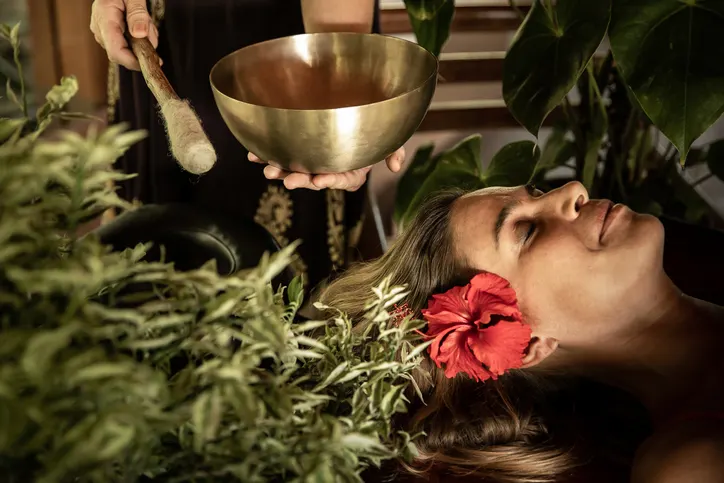 Ayurvedic therapy with singing bowl and traditional wellness practices for mind, body and spirit.
